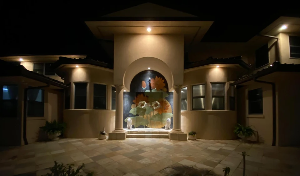Illuminated entrance and courtyard of Morad Shaker’s Portlock home in Hawaii
