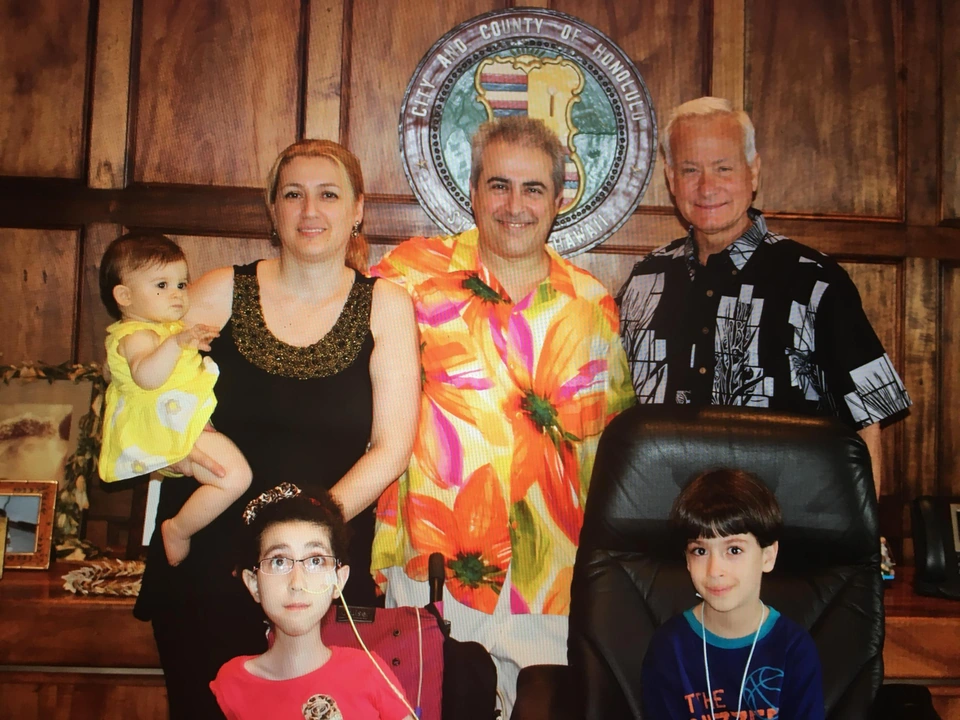 The Shaker family pictured with Honolulu Mayor Kirk Caldwell during a visit with Alex Shaker.